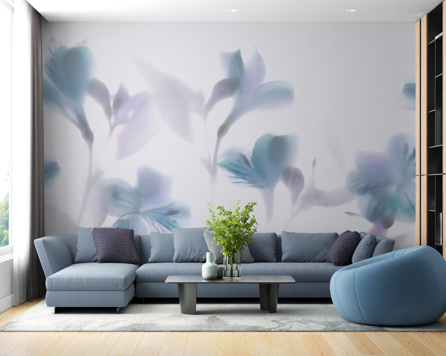 Modern living area with a blue sectional sofa and orchid wall mural.