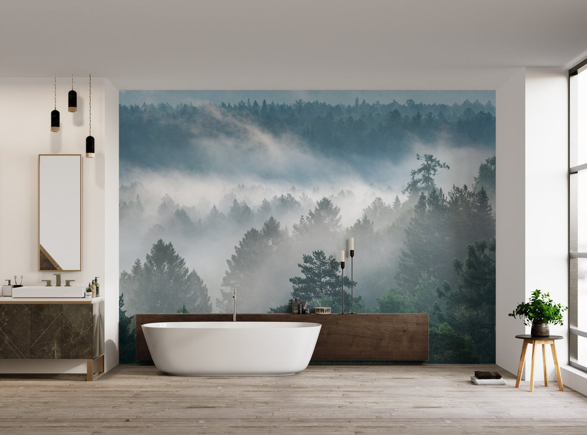 Atmospheric pine tree misty wallpaper with ethereal white clouds drifting through branches.