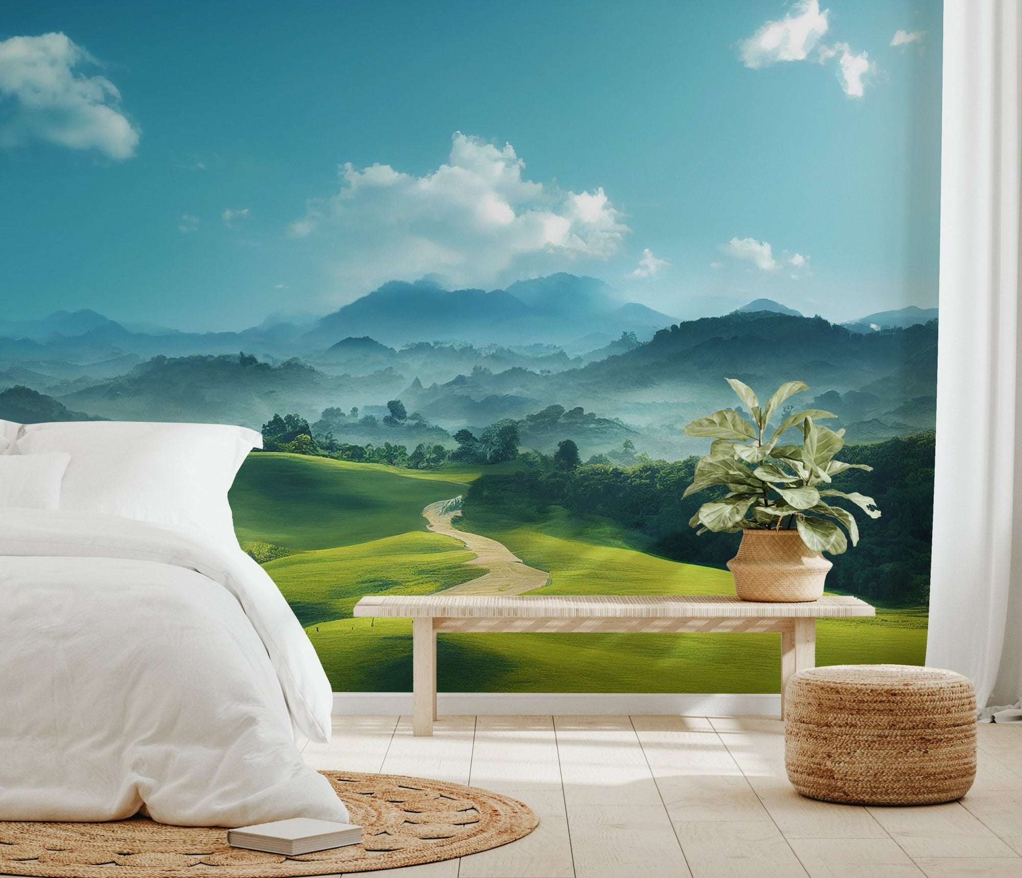 Rolling emerald meadows and foggy hills peaks wall mural.