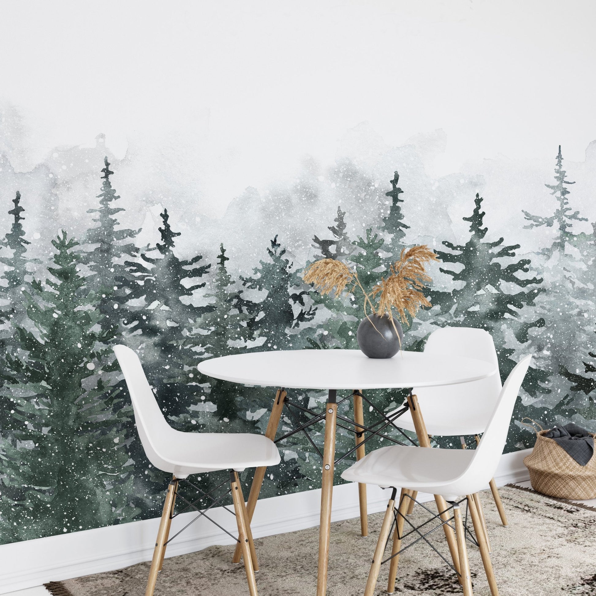 Watercolor forest wall mural in a dining area with white chairs and round table