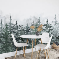 Watercolor forest wall mural in a dining area with white chairs and round table