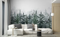 Foggy alpine forest wall mural in a bright living with white modular seating