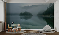 Ethereal morning mist over a mountain lake for a tranquil wallpaper.