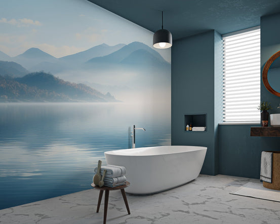 Blue landscape mountain wallpaper featuring distant peaks and a still lake.