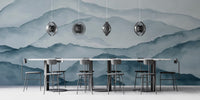 Minimalist mountain wallpaper showing layered ridges in a monochromatic blue palette.