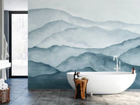Watercolor misty mountain range wall mural featuring light gray and deep teal tones.