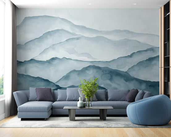 Misty mountain range wall mural with blue watercolor peaks in a layered design.