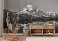 Misty mountain wall mural creating a serene ambiance in nursery.
