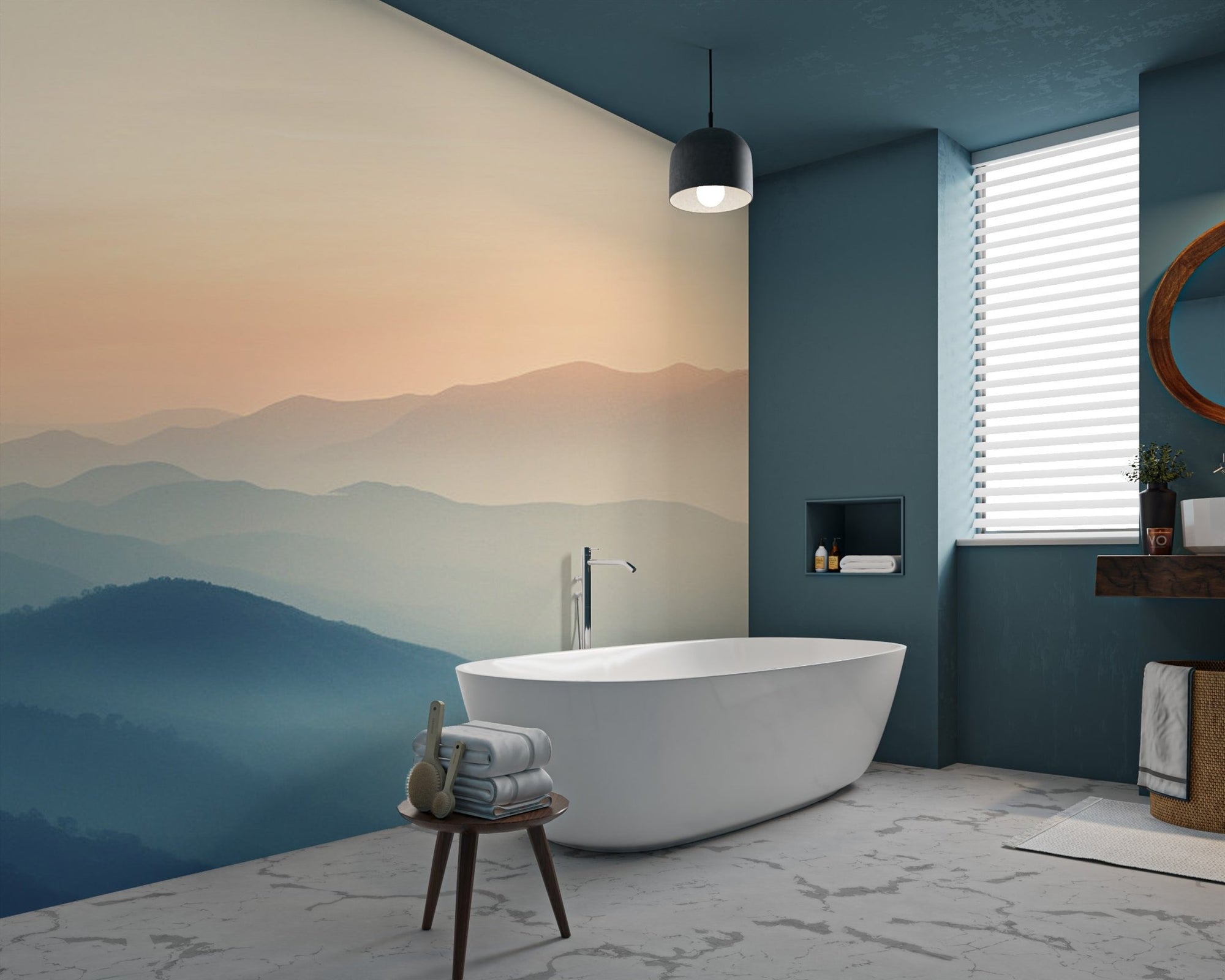 Misty sunrise mountain landscape wallpaper with blue ridges and peach sky.