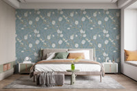 Nature inspired botanical wallpaper with ivory flowers on turquoise base for bedroom wall.
