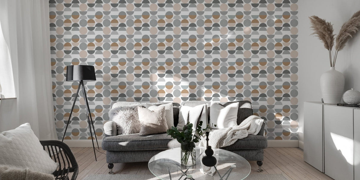 Grey and beige circle wallpaper in a modern living room with a grey sofa.