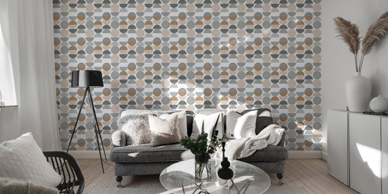 Grey and beige circle wallpaper in a modern living room with a grey sofa.