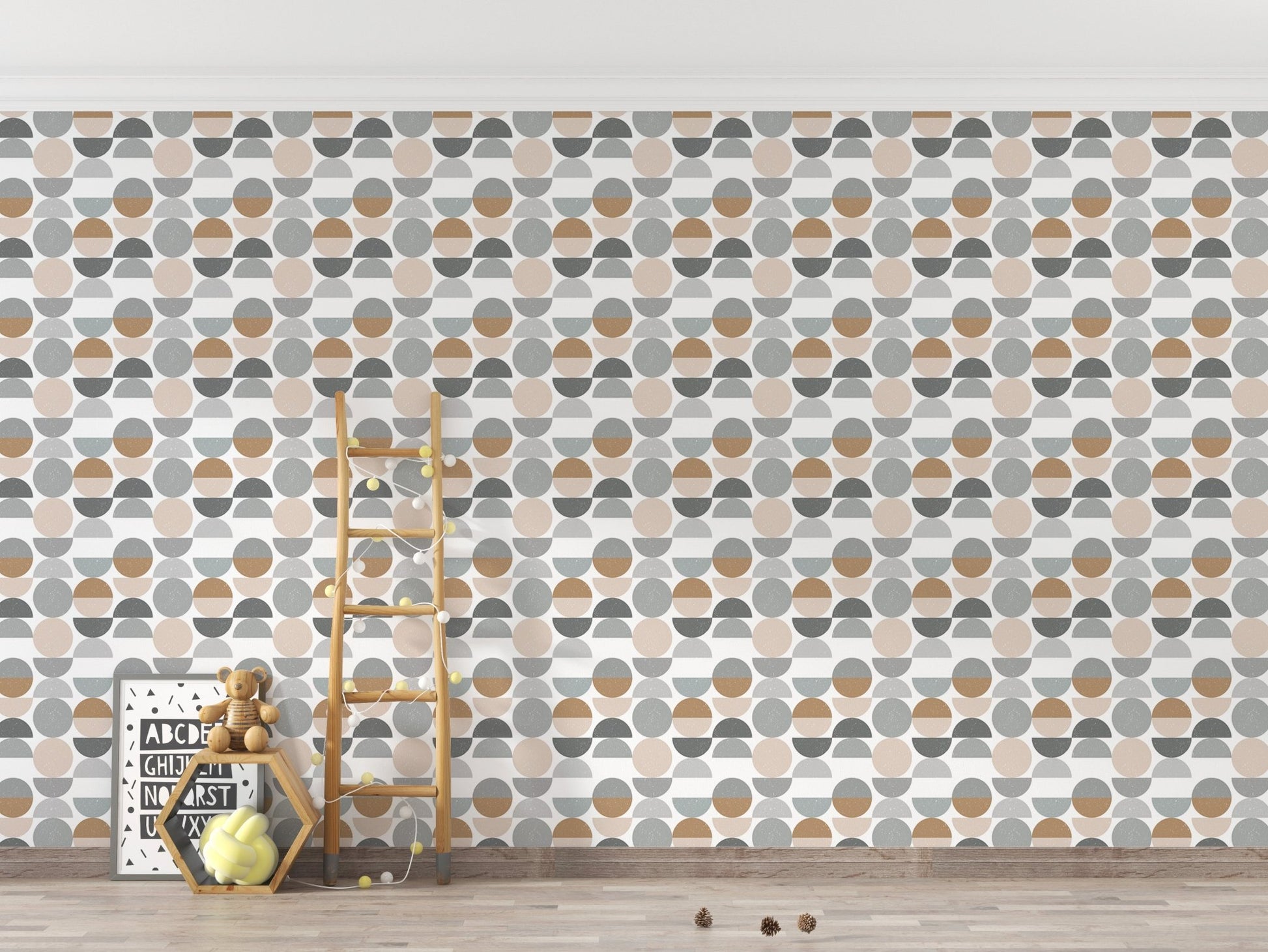 Modern abstract circles wallpaper in a minimalist nursery with a wooden ladder.