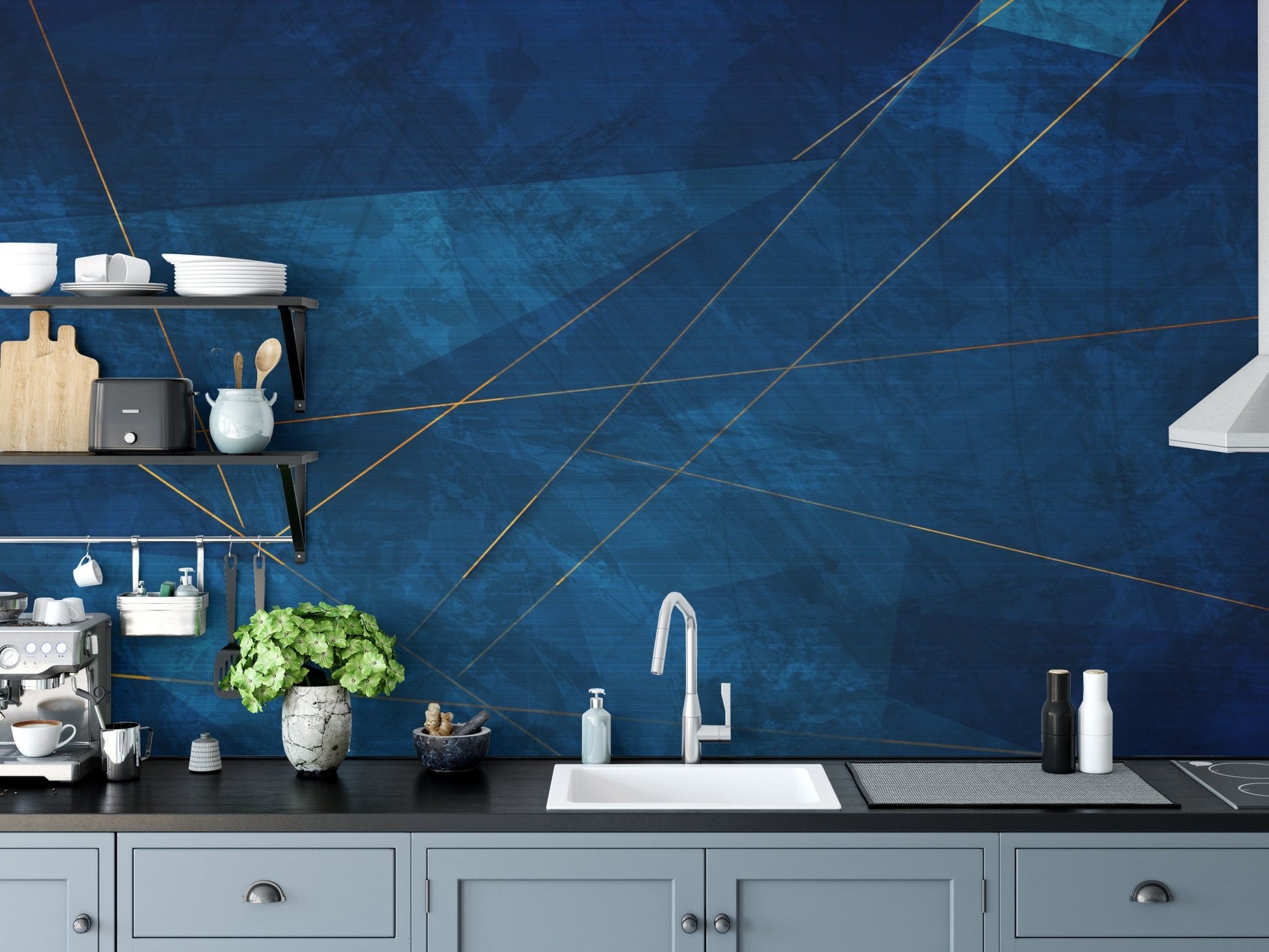 Geometric gold line abstract wall mural on a kitchen wall with grey cabinetry and white sinks.