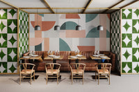 Geometric wall mural in modern restaurant interior.