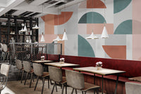 Geometric shapes wall mural with terracotta arches and grey squares.
