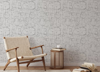 Modern Roman Classic Alphabet Method Geometric Wallpaper in reading area with a woven chair.