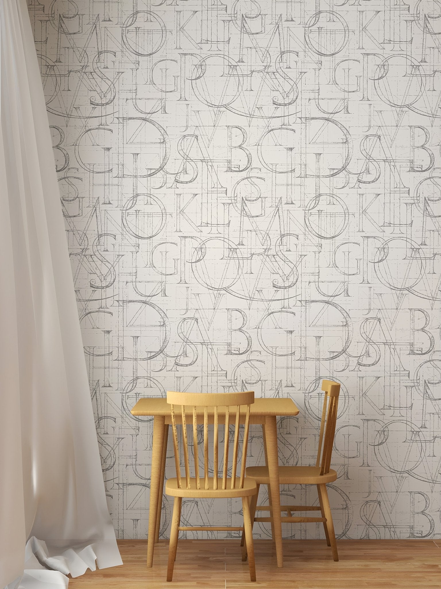 Alphabet geometric wallpaper in a child's dining area with a small wooden table.