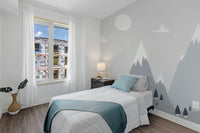 Modern Scandinavian Alpine Charm Murals in a guest bedroom with blue bedding.