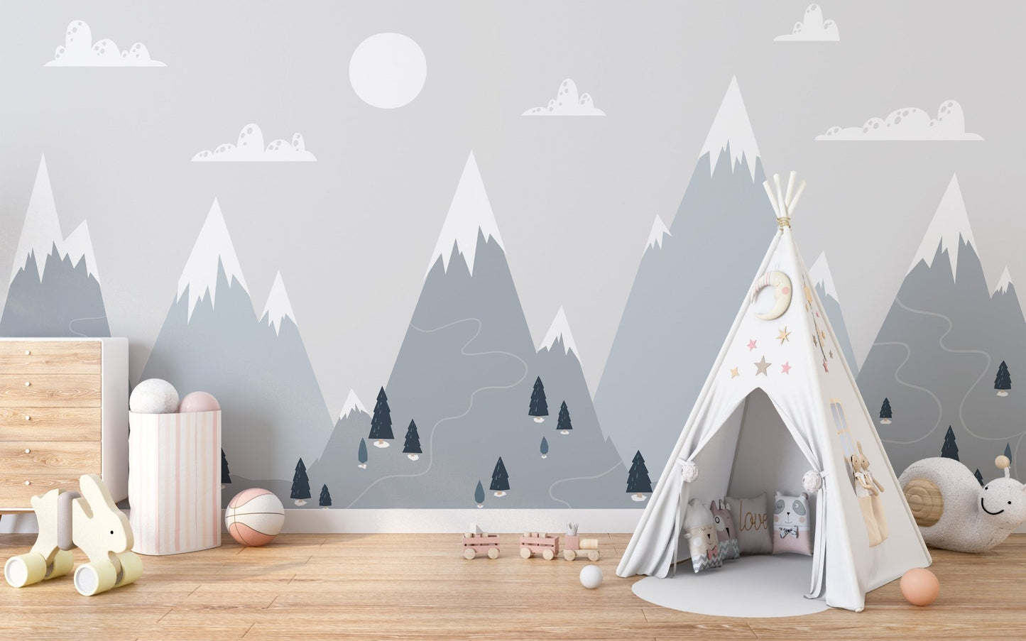 Minimalist mountain charm wall mural in a bedroom featuring a white teepee tent.