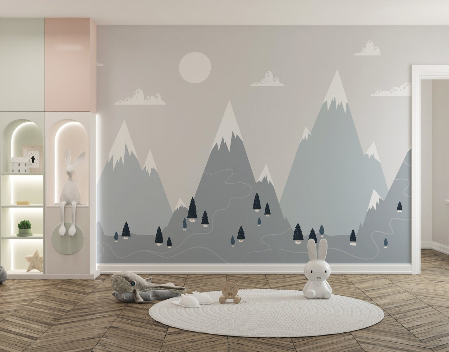 Scandinavian mountain range wall mural in a spacious playroom with a round rug.