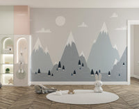 Scandinavian mountain range wall mural in a spacious playroom with a round rug.