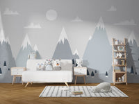 Grey mountain charm wall mural behind a white wooden sideboard in a play area.