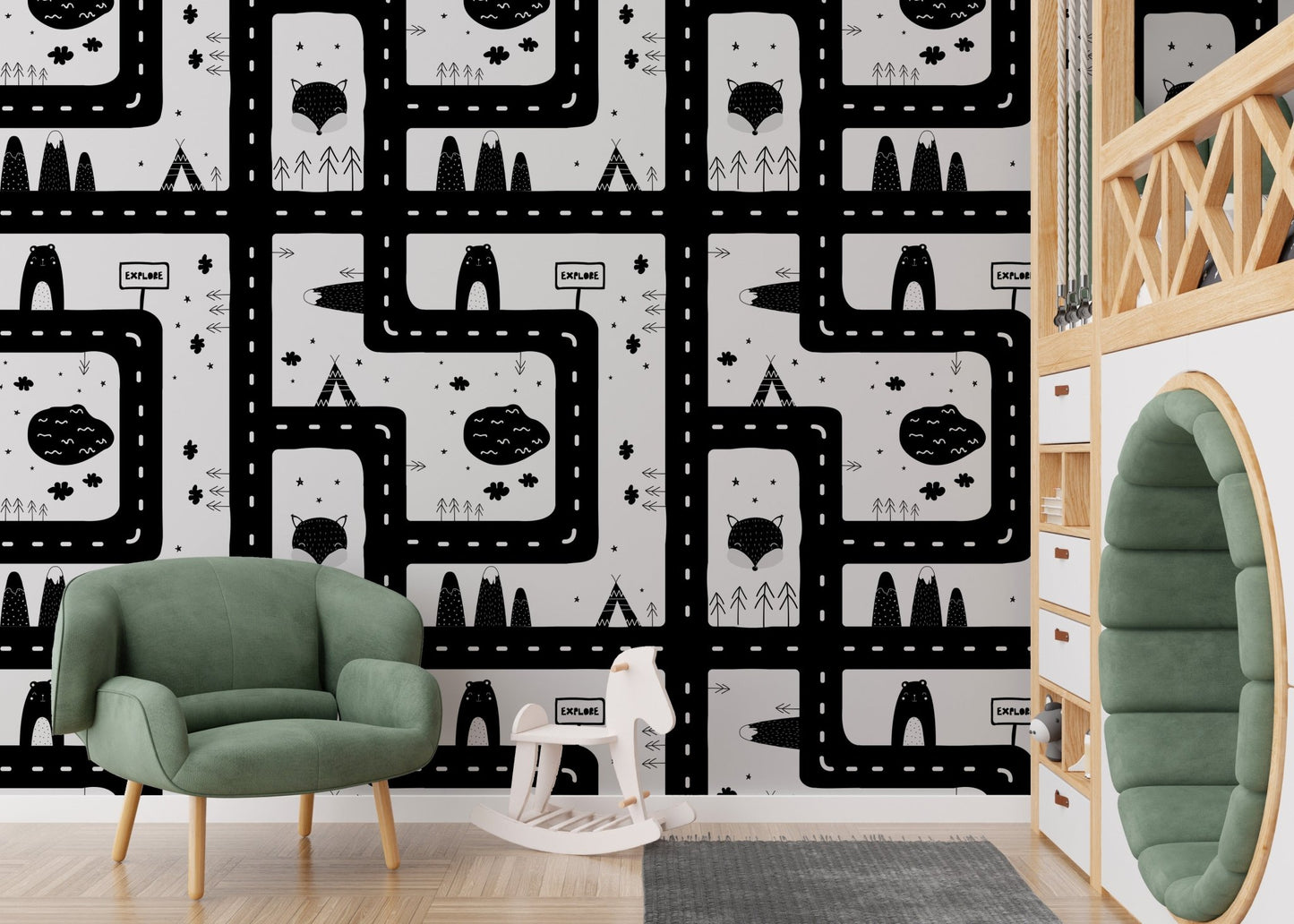 High contrast cityscape road map wallpaper behind a green armchair in a nursery