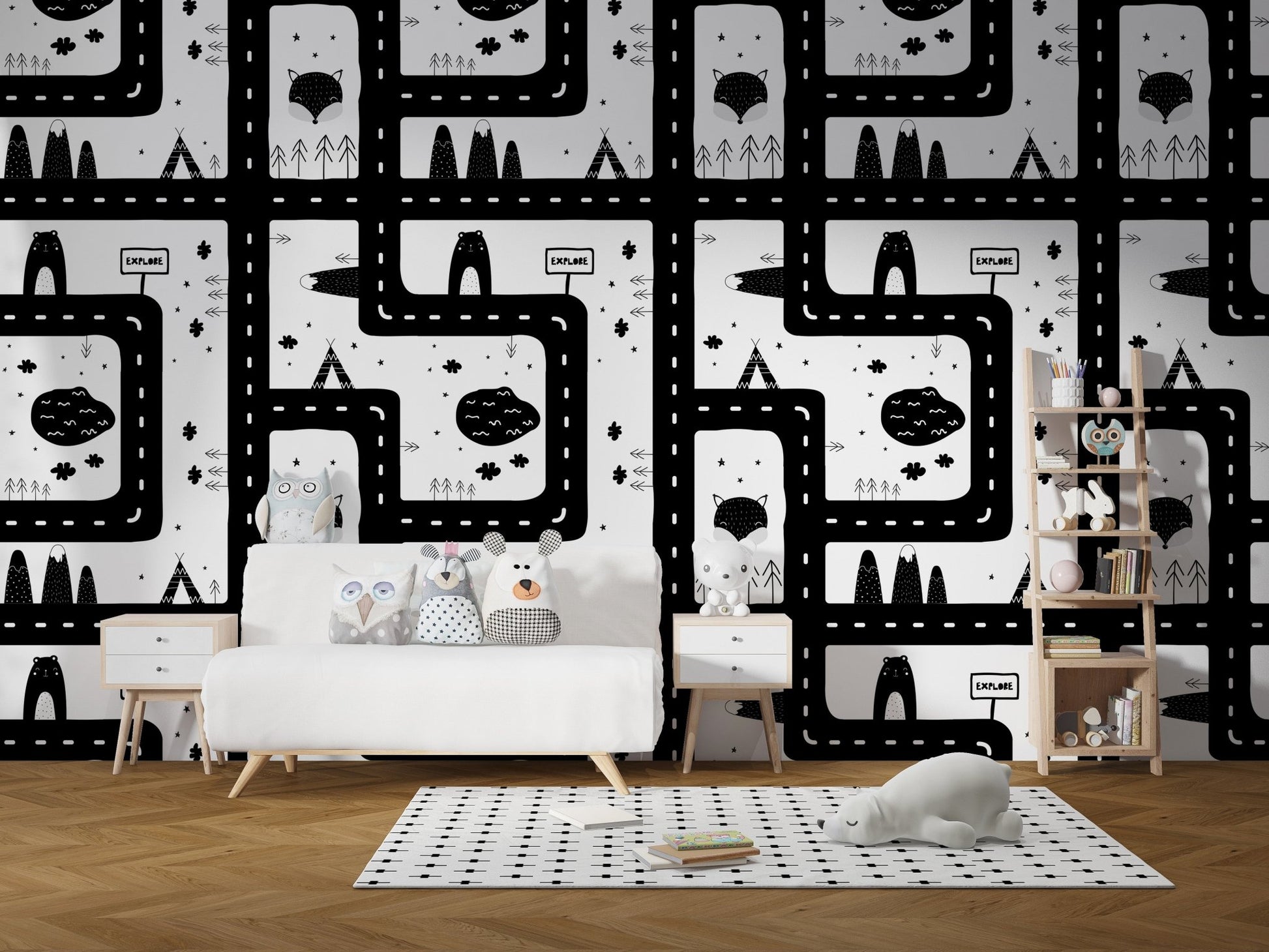 Black and white city road map wallpaper in a playroom with a white sofa