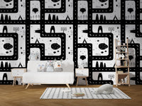 Black and white city road map wallpaper in a playroom with a white sofa