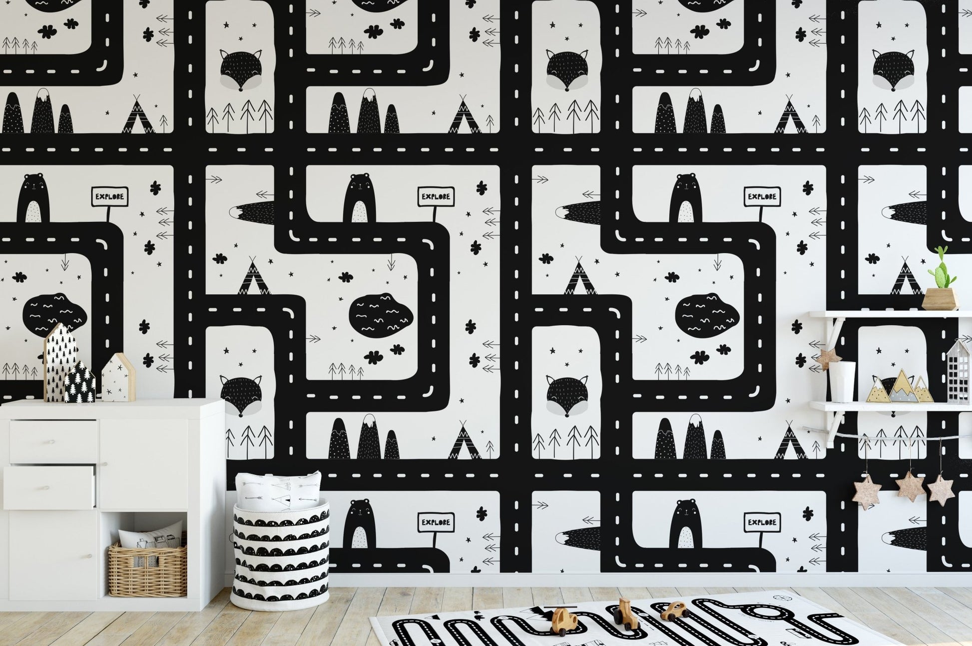 Black and white cityscape pattern wallpaper for a modern kids' room.