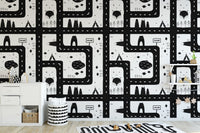 Black and white cityscape pattern wallpaper for a modern kids' room.