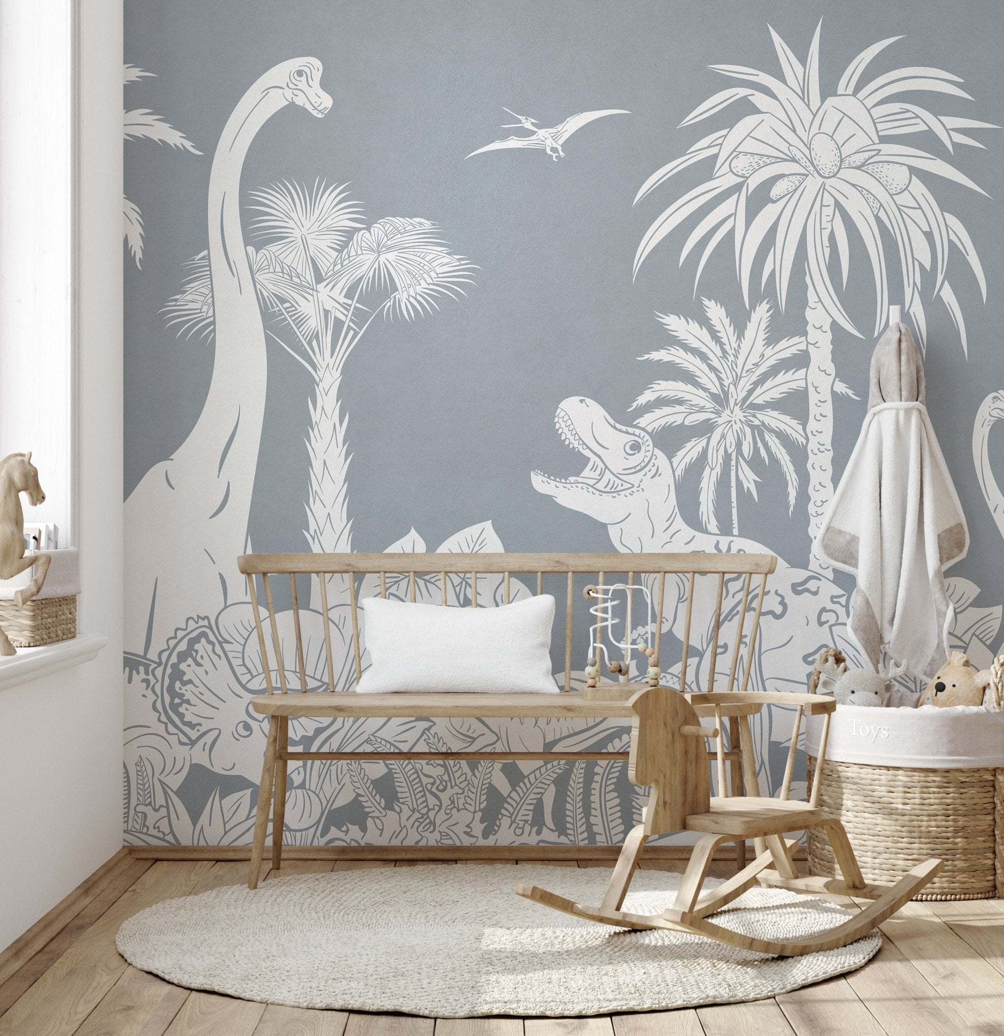 Monochrome dino blue mural featuring white line art of a T-Rex and palm trees.