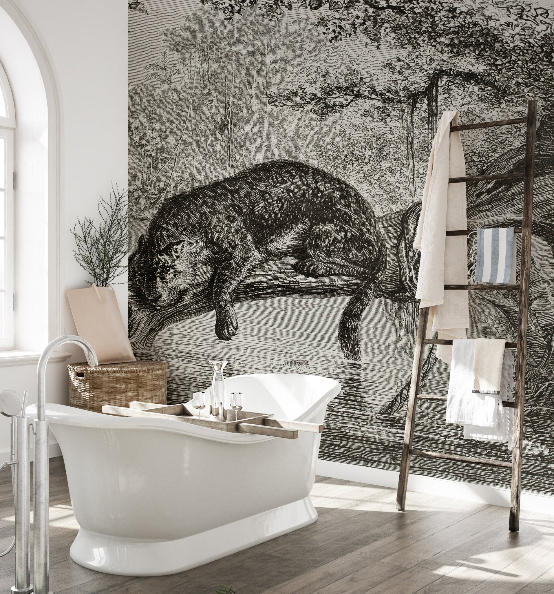 Large scale leopard wall mural in a bright bathroom with a classic white tub.