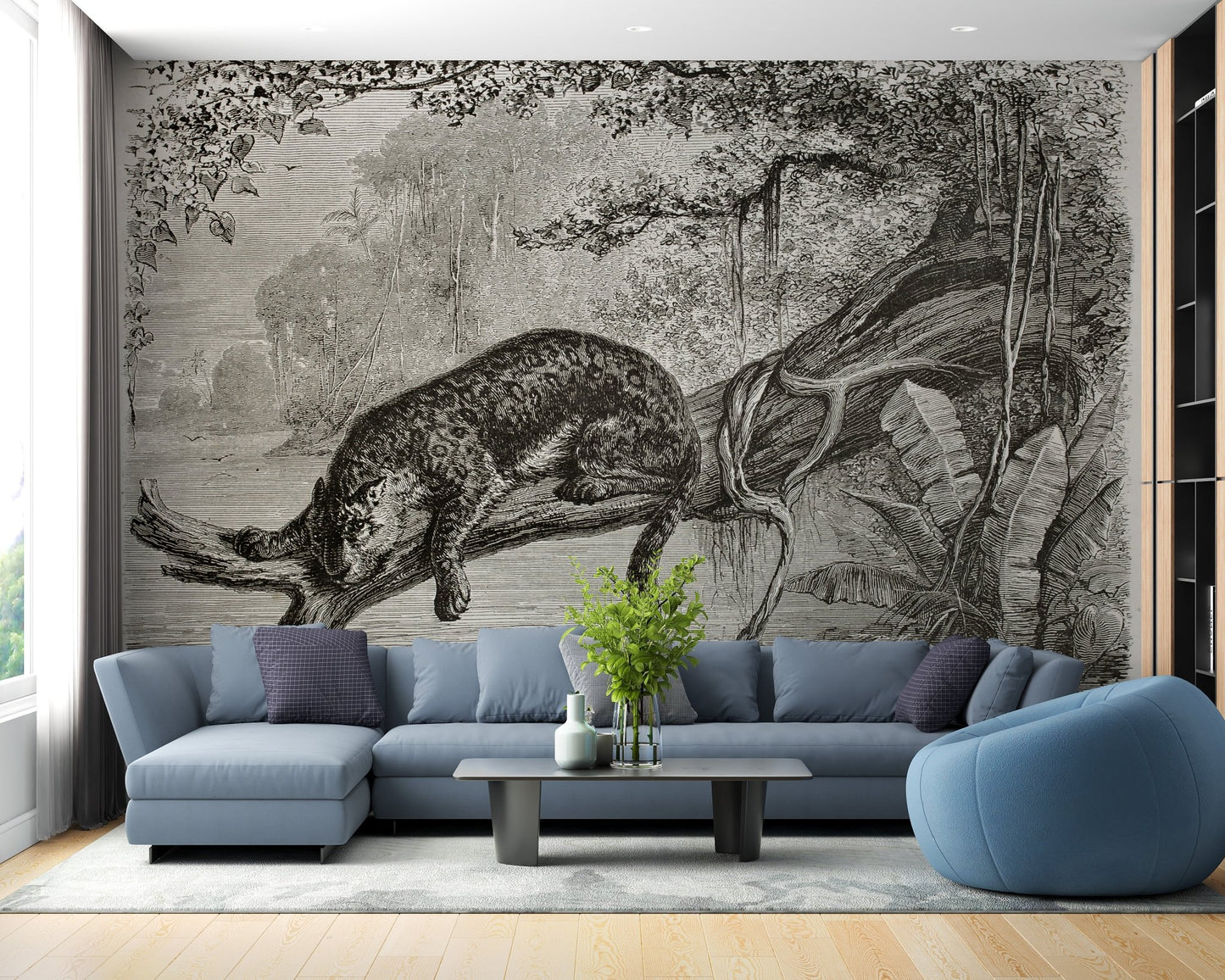 Monochrome Leopard Wall mural in a modern living room with a blue sectional sofa.