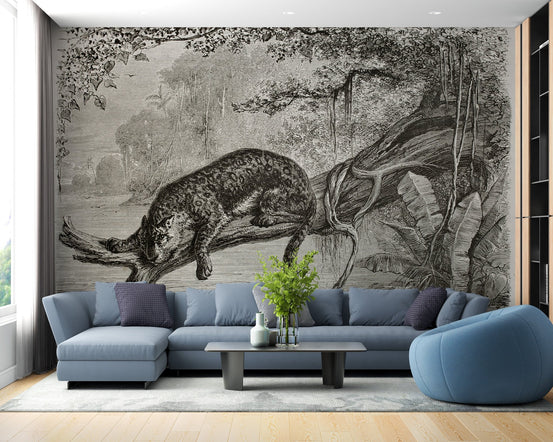 Monochrome Leopard Wall mural in a modern living room with a blue sectional sofa.