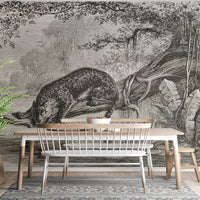 Monochrome leopard wall mural in a dining area with a wooden table and bench.