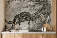 Kitchen backsplash area featuring a monochrome leopard wall mural scene.