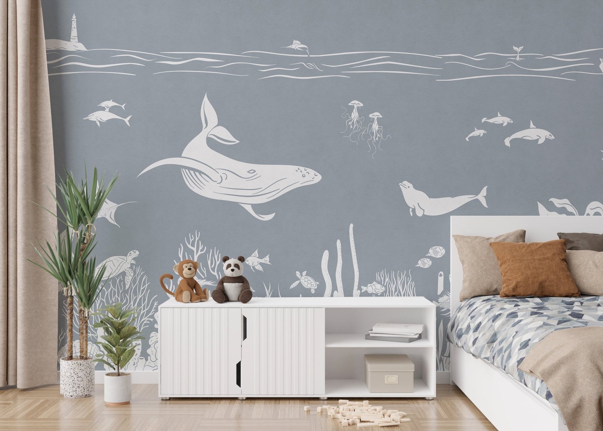 Coastal themed wallpaper wall mural in monochrome blue ocean pattern.