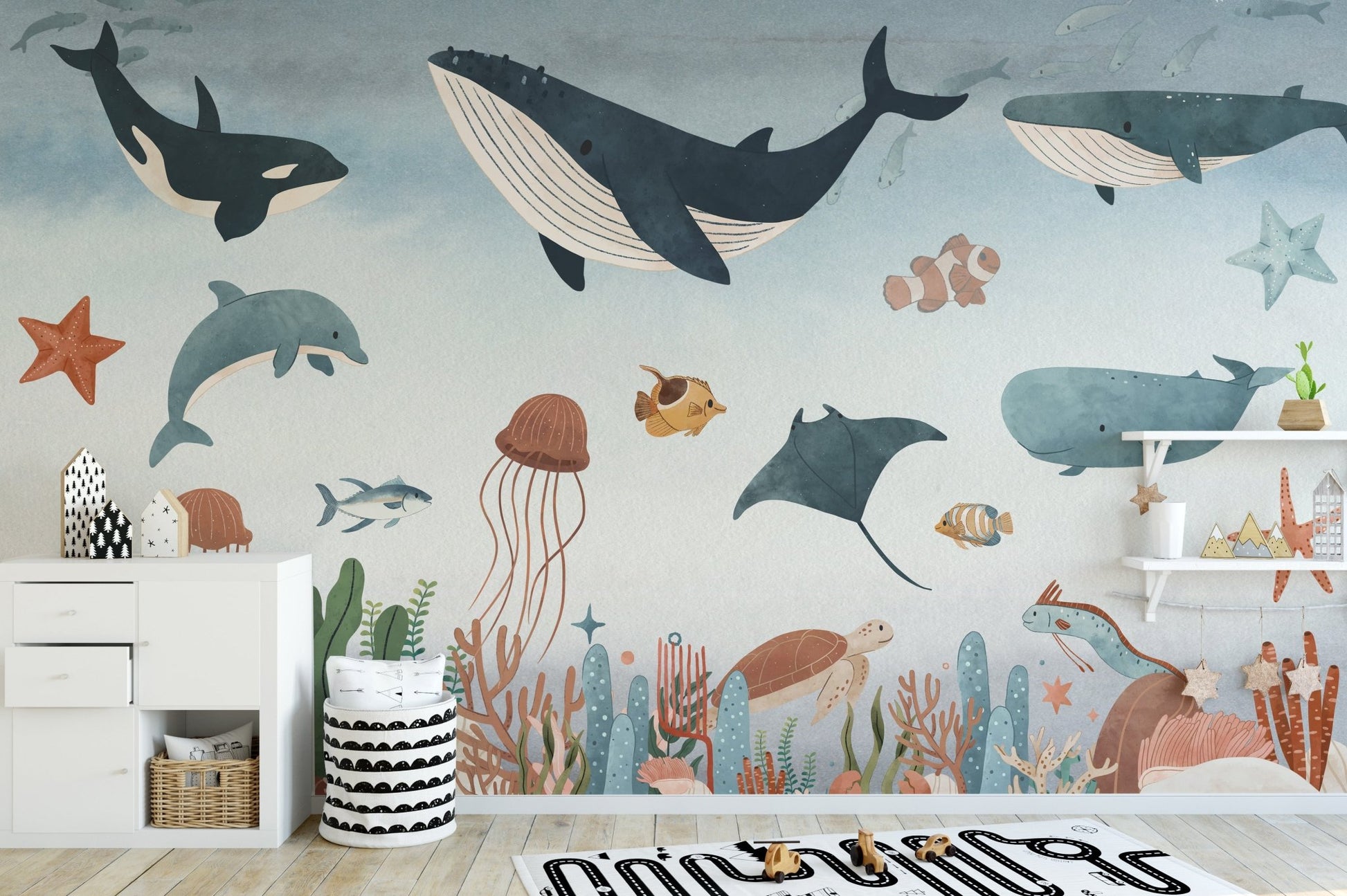 Underwater animal wall mural featuring a large whale and coral reef in kids area.