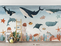 Blue and grey underwater wall mural in a kids room with a wooden ladder.