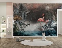 Dark botanical leaves wall mural with pink flamingo accents in a large open kids area.