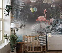 Monstera leaves wall mural featuring pink flamingos in a nursery setting.
