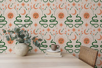Moon, sun, and snakes in Boho wallpaper for dining interiors.