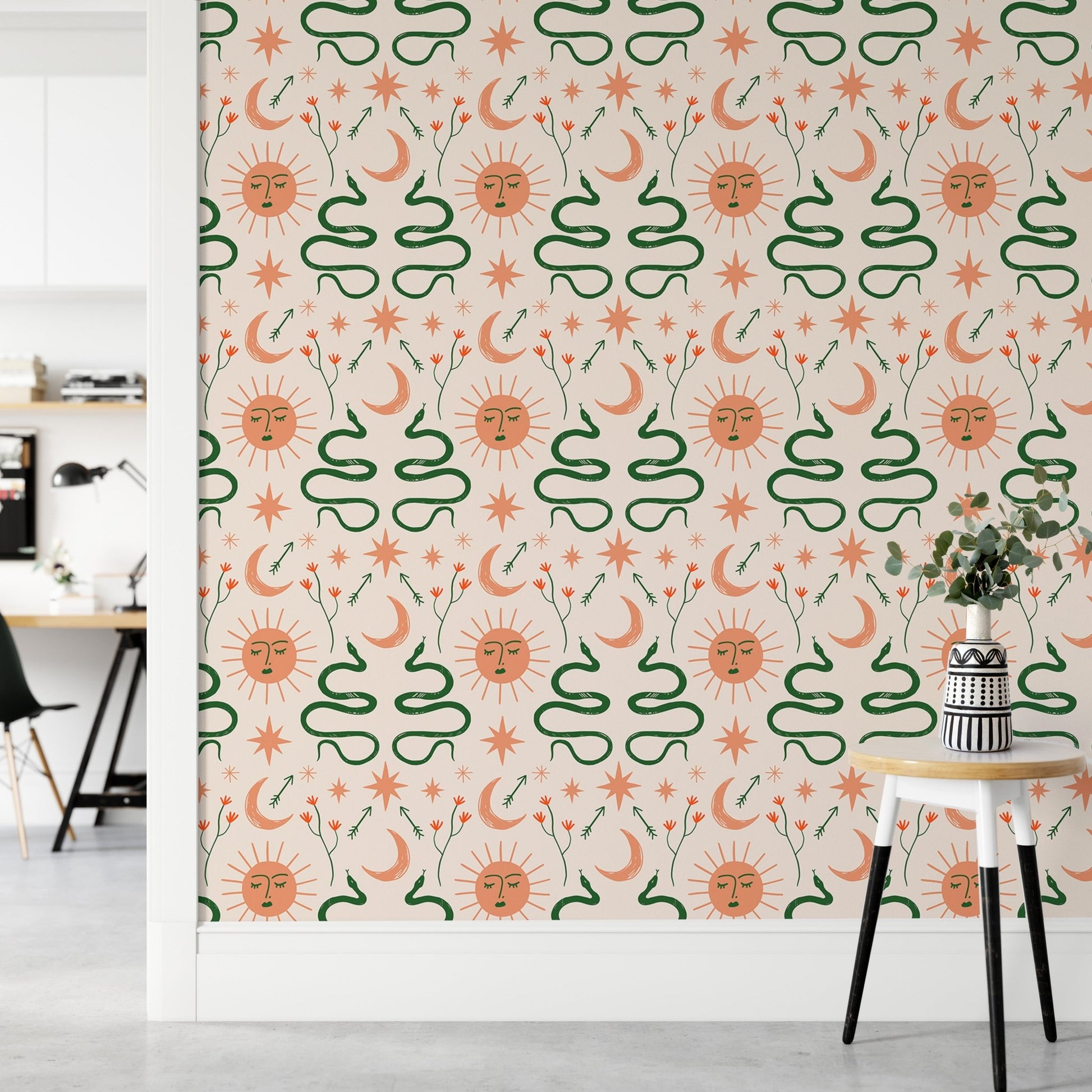 Decorative Boho snakes wallpaper with moon and sun motifs in hallway.