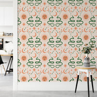 Decorative Boho snakes wallpaper with moon and sun motifs in hallway.