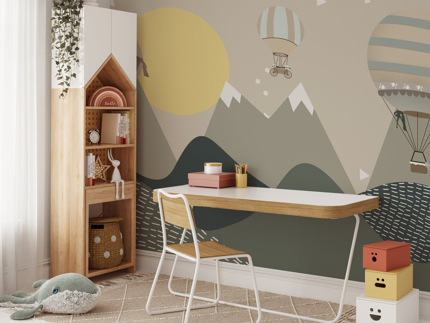 Child's study area with a adventure themed wall mural and wooden desk.