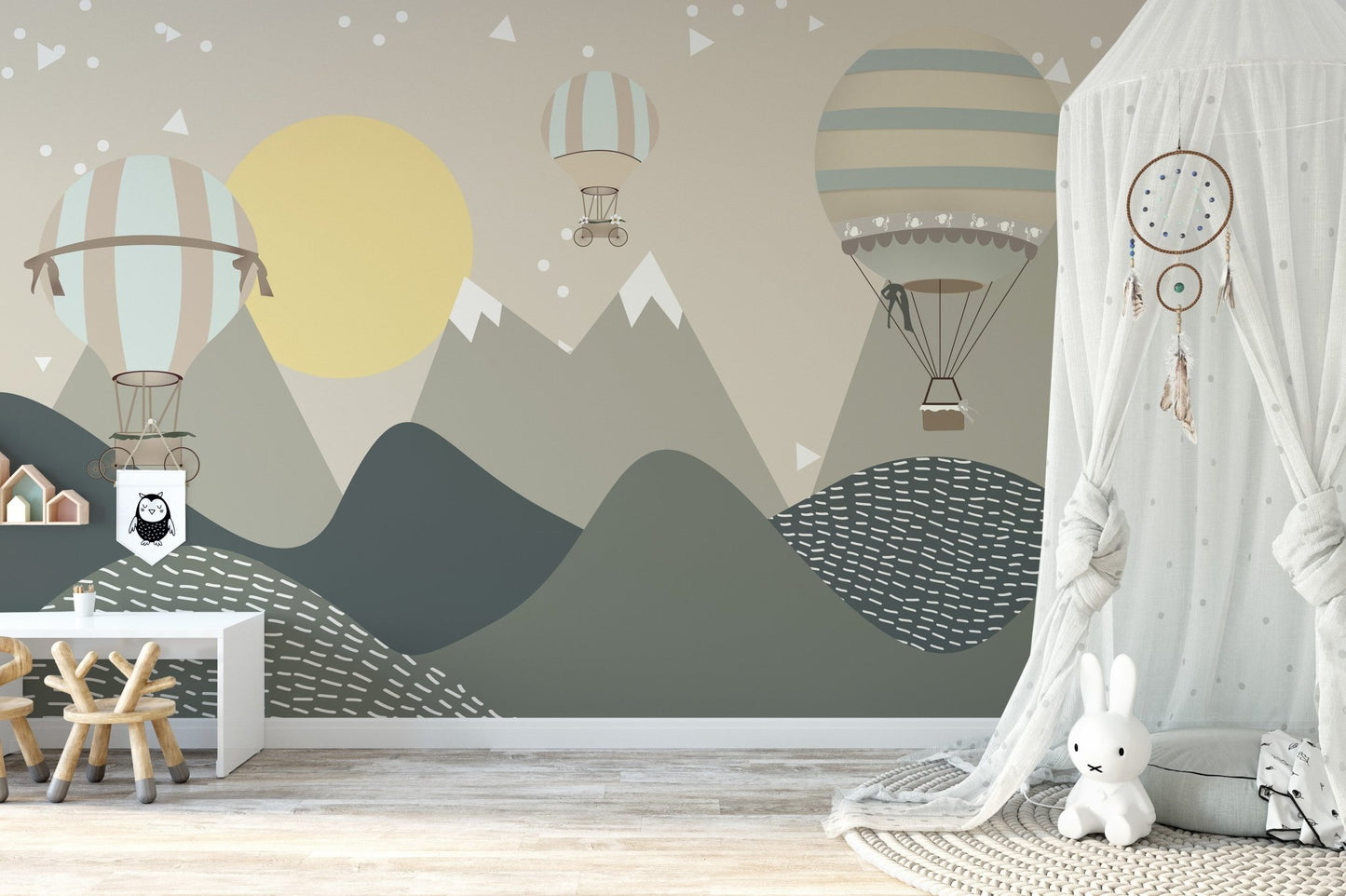 Neutral nursery decor featuring a hot air balloon and moonbeam wall mural.
