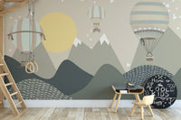 Wooden activity table for children with moonbeam landscape wall mural.