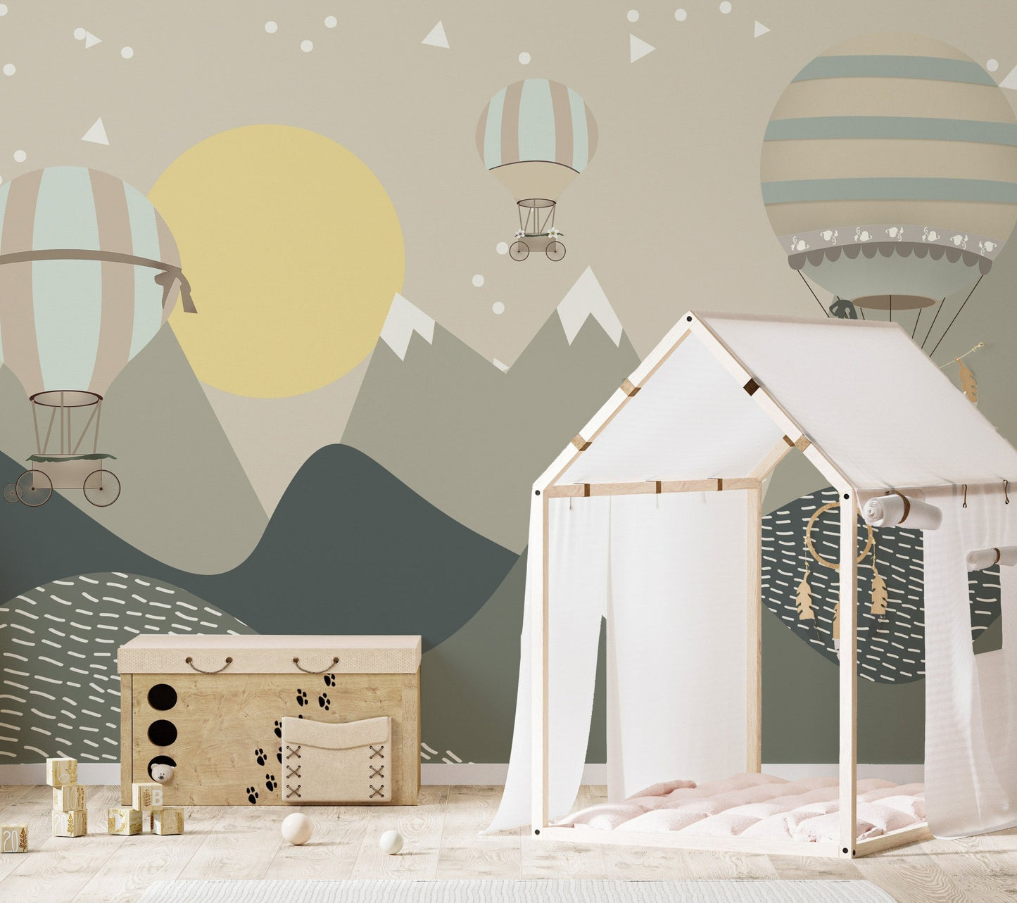 Nursery wall mural featuring alpine mountains and a large yellow moon pattern.